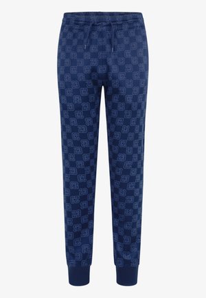 Pantalons de survêtement navy avec un motif logo intégral, taille élastique avec cordon de serrage et chevilles côtelées. Texture de tissu douce pour le confort.
