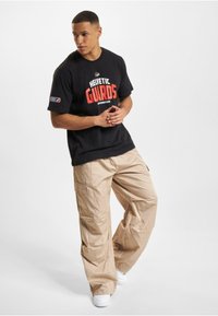 DEF EUROPEAN LEAGUE OF FOOTBALL  HELVETIC GUARDS  - Apdrukāts T-krekls - black