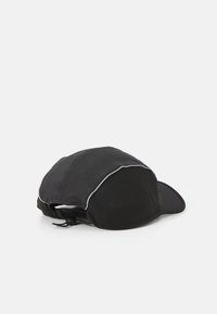 Black cap with a textured mesh back, curved visor, and reflective detailing along the seams. Adjustable strap at the rear for fit.