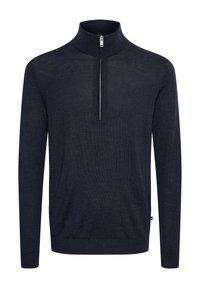 Navy blue pullover sweater with a high collar. Made from a textured knit fabric, featuring a half-zip closure at the front. Long sleeves.