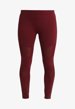 Bordeauxkleurige sportleggings gemaakt van rekbare stof, met gaaspanelen bij de knieën en een soepele, aansluitende pasvorm.