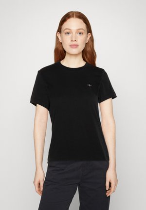 T-shirt nera a maniche corte realizzata in morbido cotone, con scollo rotondo e un piccolo logo ricamato sul petto.