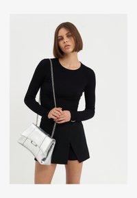 Selezionato, silver-coloured