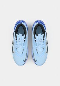 Light blue athletic shoes with black accents, mesh upper, lace-up design, and cushioned sole. Features a glossy, transparent midsole.