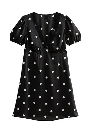 Vestito nero a maniche corte con pois bianchi, scollo a V profondo rifinito con pizzo e maniche a sbuffo arricciate.