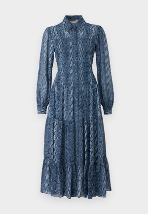 Long-sleeve, blue snake-print dress with a collared neckline, smocked bodice, and flared ruffled hem, made of lightweight, textured fabric.