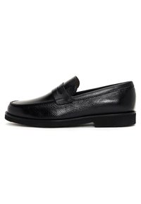 Black leather loafers with a textured finish, rounded toe, and a stitched band across the front. Low flat sole with minimal tread.