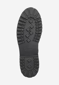 Suola di scarpe in gomma nera con scanalature profonde, motivi esagonali e a croce per una presa ottimale, e un'area liscia con il nome del brand impresso.