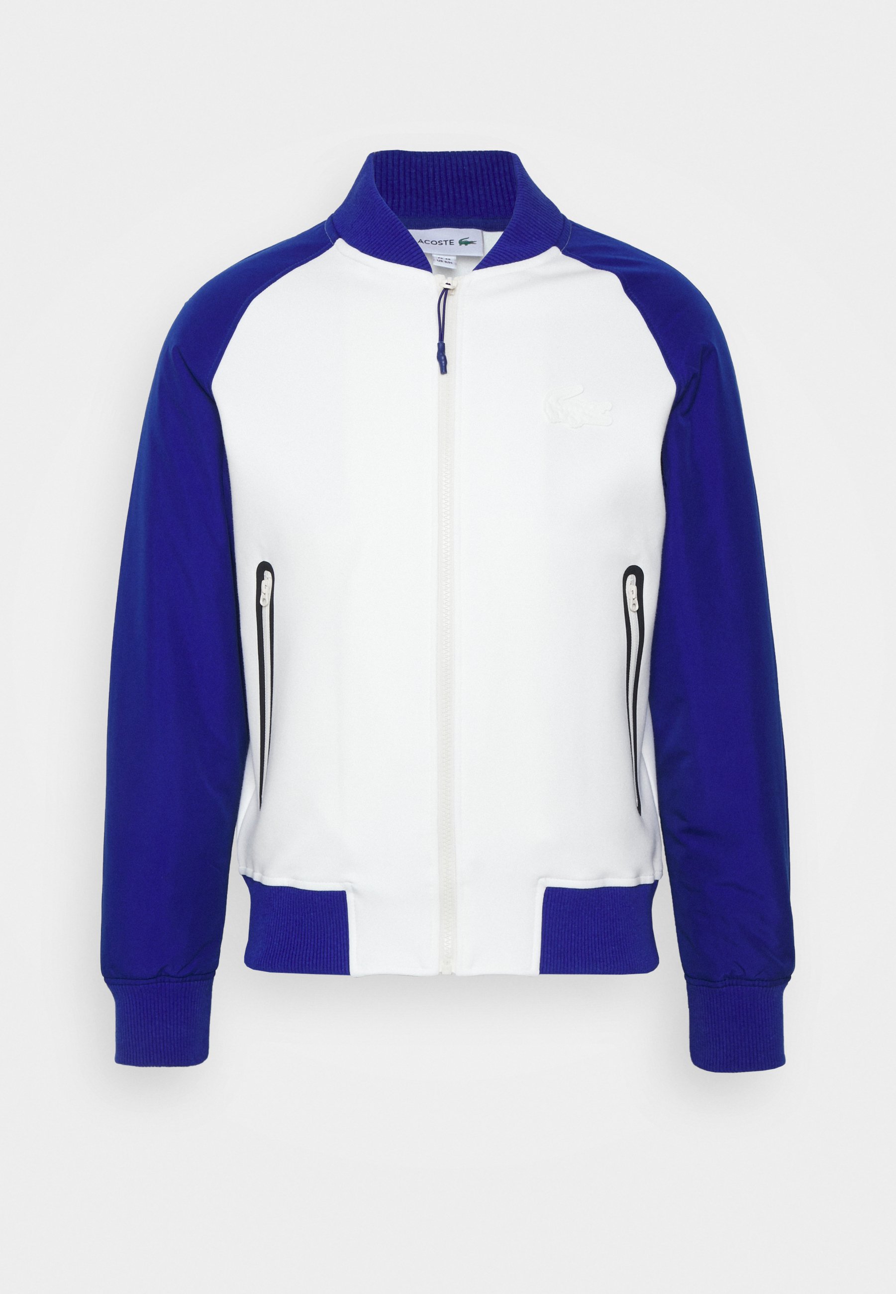 Hombre Chaqueta ligera de hombre Lacoste SPORT, plegable y resistente al  agua con cremallera Blanco / Azul Marino / Amarillo | Chaquetas y abrigos  Lacoste « Extrabalon