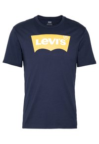 Námořnická modrá bavlněná tričko s velkým žlutým logem Levi's na přední straně, s kulatým výstřihem a krátkými rukávy.