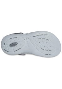 Biała podeszwa Crocs charakteryzuje się teksturowanym wzorem zapewniającym przyczepność, lekką konstrukcją oraz subtelnymi szarymi akcentami. Zawiera logo "LiteRide" i otwory drenażowe.