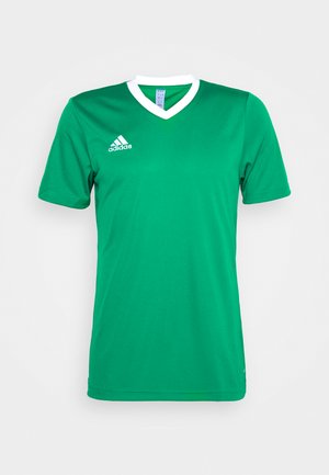 Grønn idrettsdrakt med V-hals, korte ermer, hvite kragekanter, og Adidas-logoen i hvitt på øvre venstre side. Glatt tekstur.