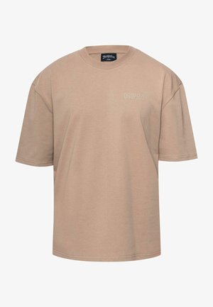 Beige katoenen t-shirt, losse pasvorm, ronde hals, korte mouwen. Bevat een subtiele "DROPSIZE" logo in bijpassende kleur aan de voorkant.