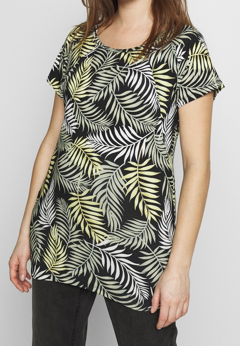 Černý krátký rukáv top s listovým zeleným a bílým potiskem palmy. Vyrobeno z měkké látky, s volným střihem a kulatým výstřihem.