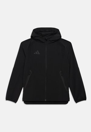 TIRO TRAVEL WINDBREAKER KIDS UNISEX - Tréning dzseki - black