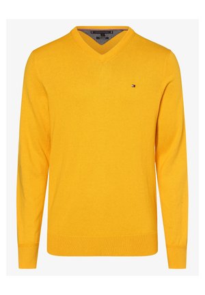 Żółty sweter z długim rękawem i dekoltem w serek, z małym logo Tommy Hilfiger na lewej piersi, ściągaczami na mankietach i u dołu.