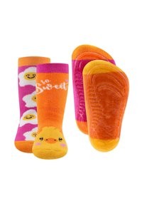 Chaussettes colorées avec un motif de canard et des œufs décorés, fabriquées en tissu doux avec des grips en caoutchouc sur les semelles pour la stabilité.