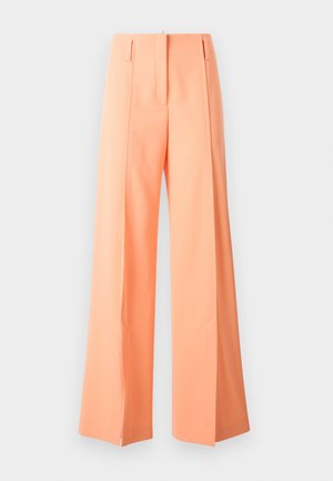 Weit geschnittene Hosen in pastellorange, maßgeschneiderte Ausführung mit Falten, aus glattem Stoff. Verfügt über seitliche Taschen und einen klaren Saum. 