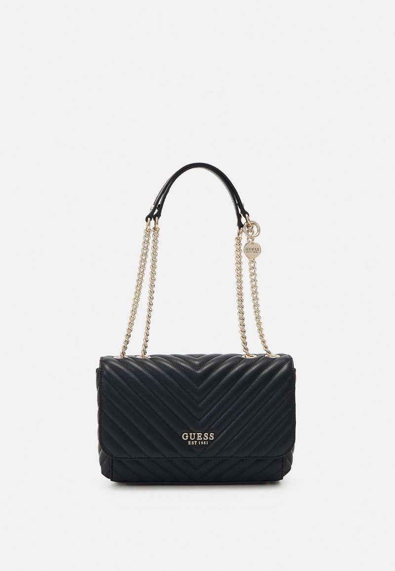 Black quilted handbag with gold chain handles, featuring a logo plate and a flap closure. The design includes a chevron pattern texture.