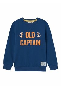 Sudadera azul marino con el texto naranja "OLD CAPTAIN" y gráficos de ancla. Presenta puños y dobladillo acanalados, y una etiqueta en la parte inferior izquierda.