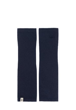 Pair of navy blue knitted arm warmers with a small fabric logo tag on one end and a thumb hole on one side.
