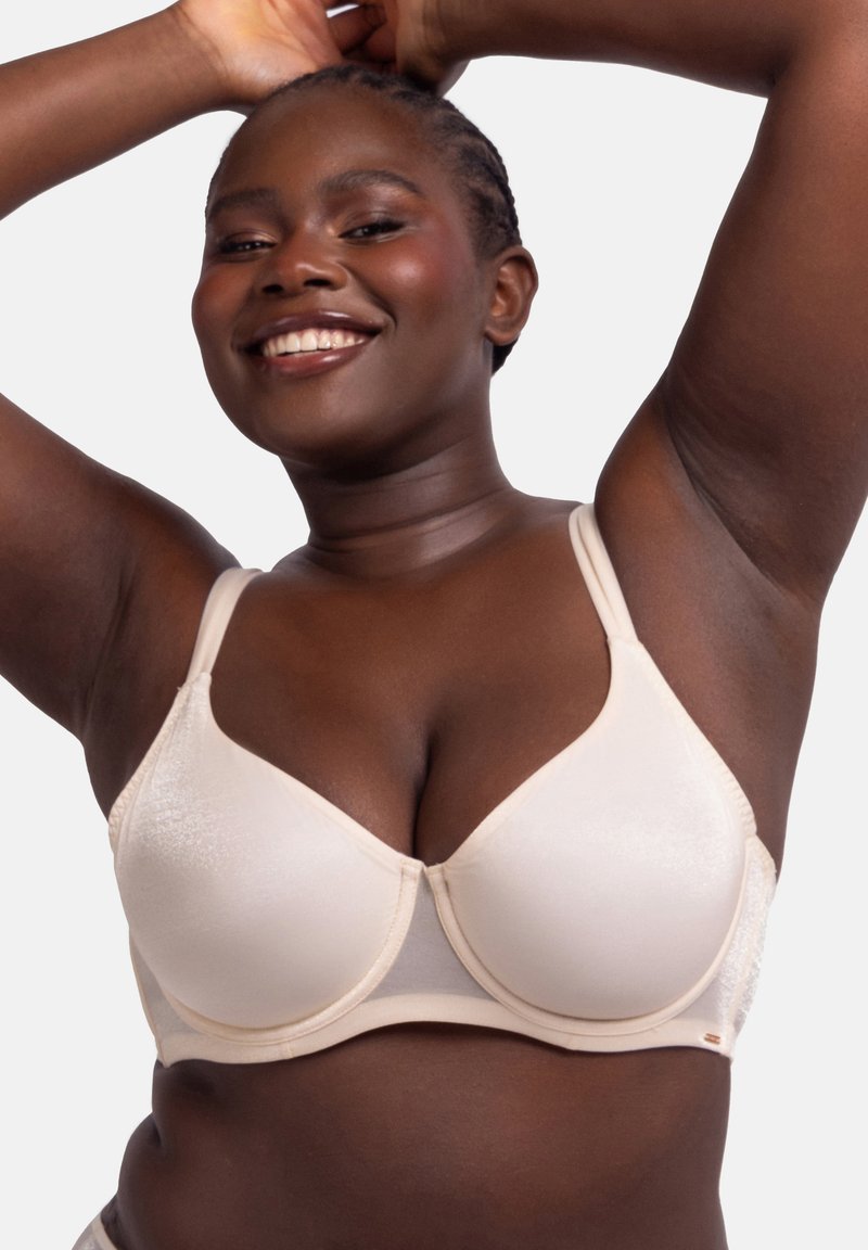 Beige padded bra with smooth fabric, adjustable straps, and underwire support. Features a subtle sheen and contoured cups.