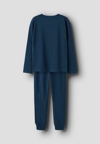 Navyblaues Baumwolloberteil mit langen Ärmeln und passender Hose, mit einem lockeren Schnitt und elastischen Bündchen an den Knöcheln. Glatte Textur ohne Muster.