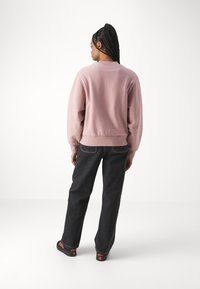 Carhartt WIP AMERICAN SCRIPT - Mikina - glassy pink