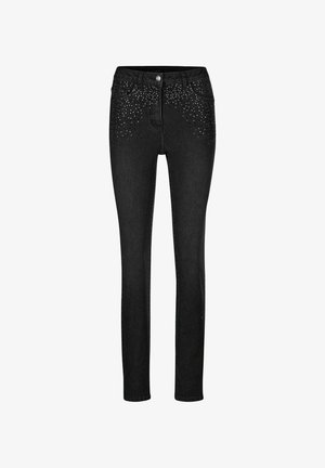 Schwarze Skinny Jeans mit verstreuten silbernen Nieten um die vorderen Taschen, Knopfverschluss und Five-Pocket-Design.