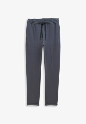Dunkelgraue, zulaufende Jogginghose mit elastischem Bund und schwarzer Kordel, mit Seitentaschen und Bündchen am Saum.