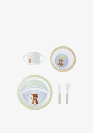 Child's divided plate, bowl, two-handled cup, fork, and spoon set with teddy bear and balloon designs and pastel striped rims.