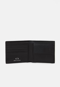 Black leather wallet featuring multiple card slots, a larger pocket, and a debossed logo. Interior is smooth with clean stitching details.