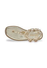 Gold flat sandal with a metallic finish, multiple straps, pyramid studs, and a textured sole. Signature logo embossed on the insole.