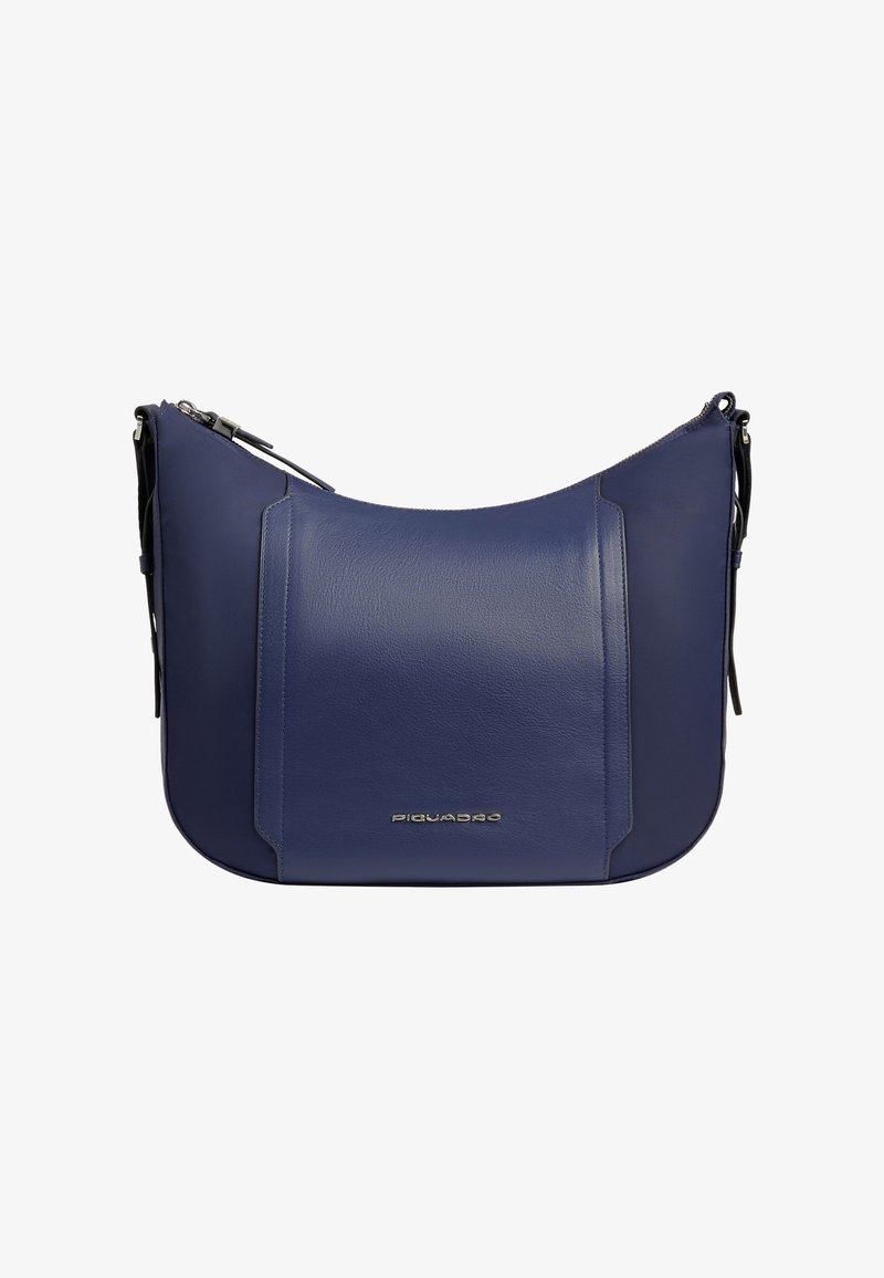 Sac à bandoulière en cuir bleu marine avec design incurvé, rabat avant, fermeture éclair argentée et petite plaque logo argentée au centre en bas.