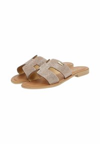 Tan flat sandals with two wide, sparkling, mesh straps and a low, square heel. Features an open toe design and subtle brand logo accent.