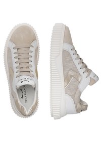 Beige sneakers featuring a combination of suede and mesh materials, white accents, textured rubber sole, and prominent lacing.