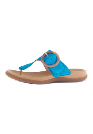 Blue suede flip-flop with a circular brown accent at the toe post, lightweight tan sole, and a smooth texture overall.
