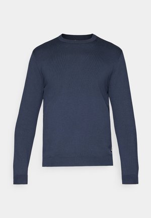 Mørkeblå crewneck-genser laget av et glatt strikkemateriale. Har lange ermer og ribbestrikkede mansjetter. Enkelt og strømlinjeformet design.
