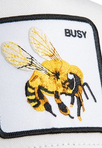 Embroidered patch featuring a yellow and black bee on a white background, with the word "BUSY" in black lettering above the bee.