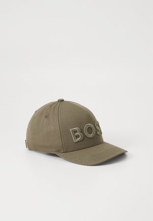 Khaki baseball cap made of fabric with a curved brim; features embroidered "BOSS" logo in matching color; six-panel design.