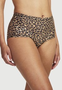 Hängsleunderkläder med leopardmönster i ett slätt tyg. Har svarta fläckar på en beige bakgrund, med elastisk midja och sydda kanter.