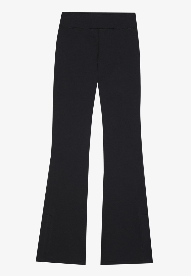Zwarte flare leggings van rekbaar materiaal, met een gladde tailleband en zijsplitten bij de zoom voor meer bewegingsgemak.