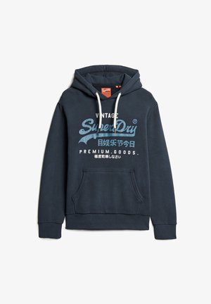 Felpa con cappuccio in cotone blu navy, con lacci bianchi, tasca a marsupio frontale e un grande logo grafico in stile vintage blu e bianco.