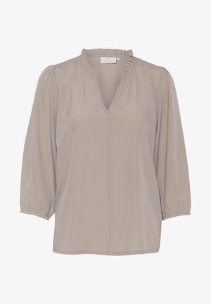 Light beige blouse with a V-neck and ruffled collar, featuring long puff sleeves and a smooth, silky texture. Simple, elegant design.