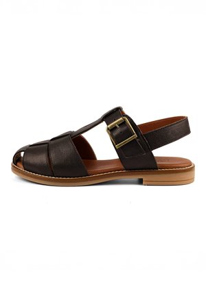 Brown leather open-toe sandal with a gold buckle strap and flat tan sole, shown from the side on a white background.