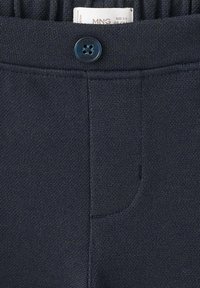 Navy blue pants with a textured fabric; features elastic waistband and a button closure. Includes a small front pocket on the side.