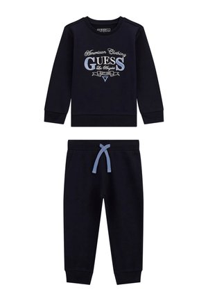 Marineblaues Zweiteiler-Set bestehend aus einem langärmligen Sweatshirt mit Logo und passenden Sweatpants mit einer hellblauen Kordel. Aus Baumwollmaterial.