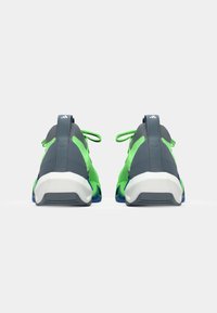 Sport shoes featuring a gray mesh upper with vibrant green accents, a white midsole, and blue outsole. Laced design with a rear pull tab.