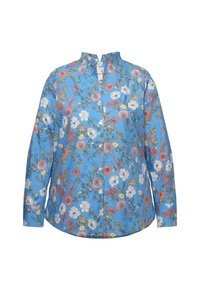 Blusa floral azul de manga larga, con cuello mao, que presenta una variedad de flores en rosa, blanco y amarillo sobre un fondo azul.