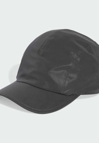 Black, lightweight cap made of shiny, water-resistant fabric. Features a curved visor and sleek design with visible stitching accents.